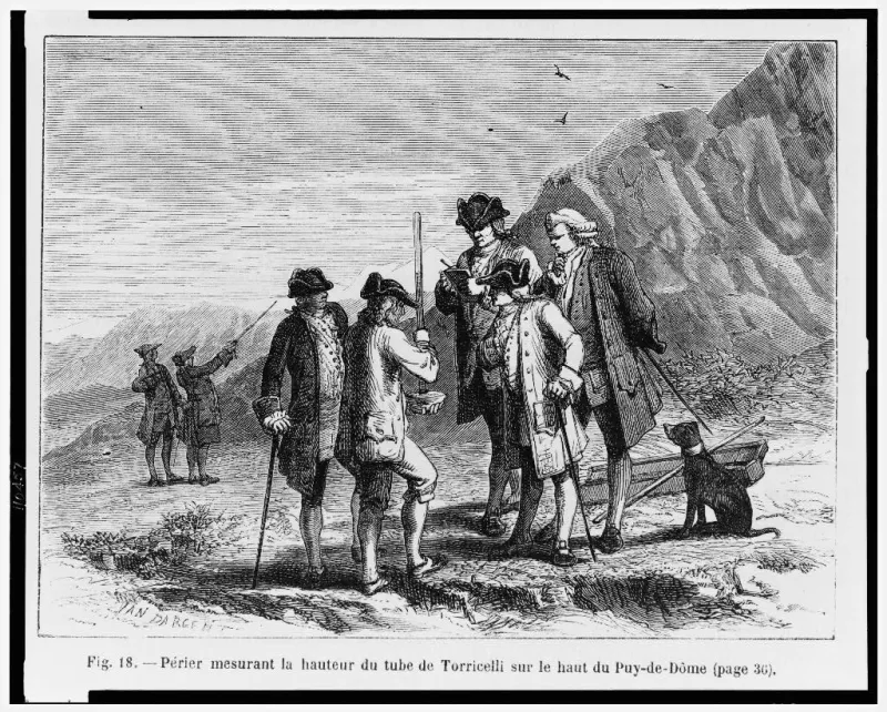 A wood engraving: a party of men in tricorn hats and long coats on a bare mountainside, one stooping to read a tall glass tube held upright by another while a third writes in a notebook; a dog and a sledge at the right, two figures pointing in the middle distance, mountains behind. The printed caption below reads Perier mesurant la hauteur du tube de Torricelli sur le haut du Puy-de-Dome
